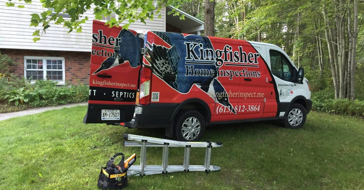 Kingfisher Inspections red, white, and blue truck alonside a ladder and toolbox