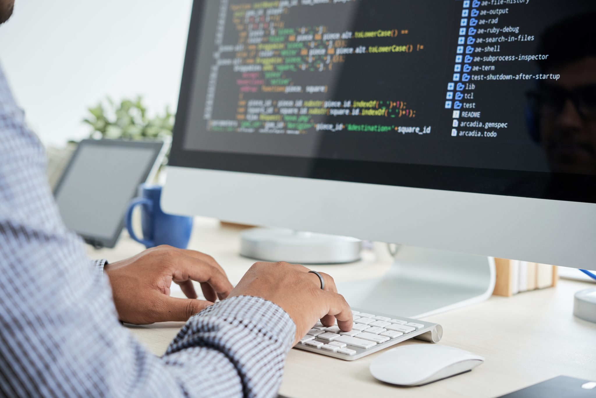 person working on a computer writing code